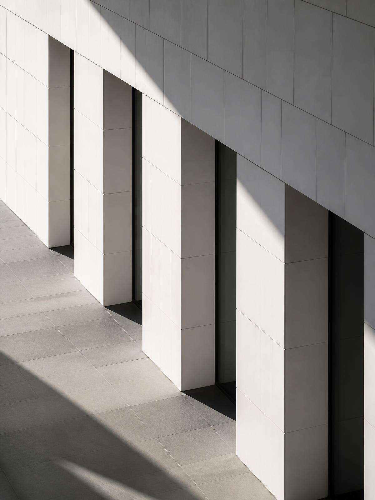 Modern architectural facade with dramatic shadows